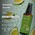 Aromafume Bergamot Room & Linen Spray with citrus slices; promotes energy, wellness, and restful sleep.
