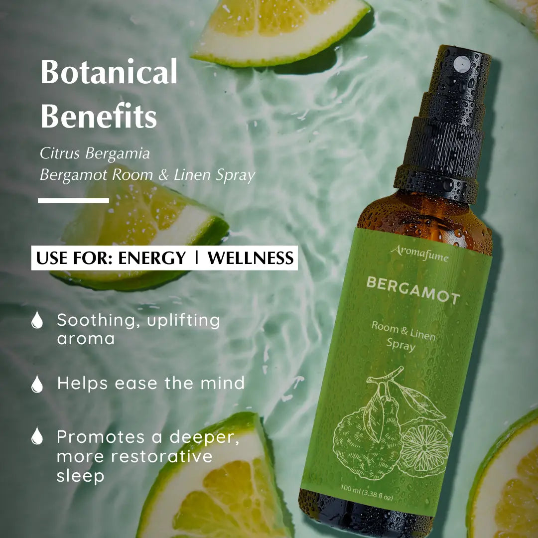 Aromafume Bergamot Room & Linen Spray with citrus slices; promotes energy, wellness, and restful sleep.

